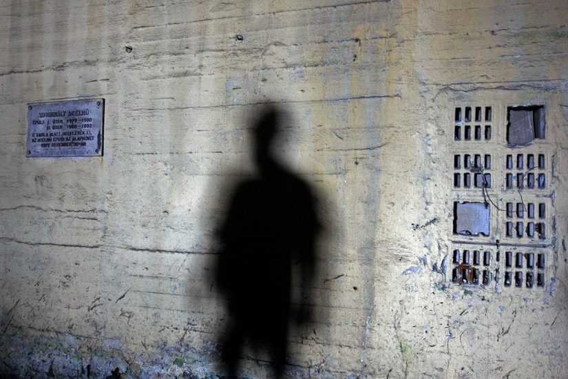 The shadow of a worker falls on a wall at Hungarian steel mill DAM in the northeastern city of Miskolc June 25, 2009. Heavy industries across eastern Europe, once the beacons of communist "planned economies", survived the collapse of communism 20 years ago but may not live to see the end of the current economic crisis. 