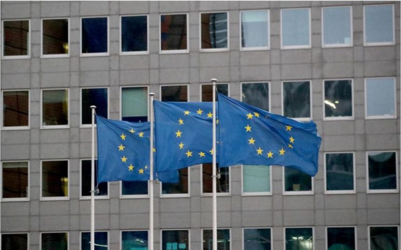 European Union flags flutter outside the European Commission headquarters