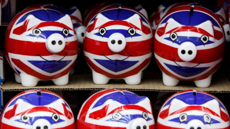 Stacked ceremic piggy banks painted with United Kingdom flags painted on them