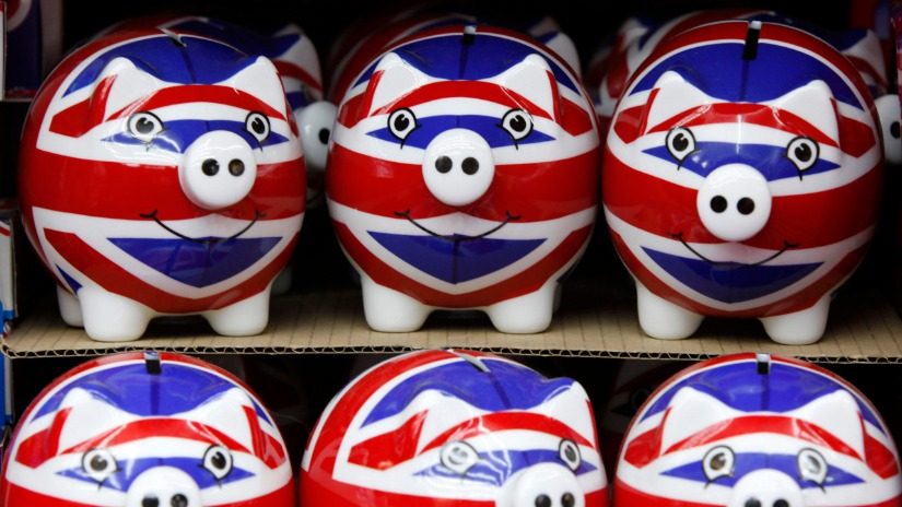 Stacked ceremic piggy banks painted with United Kingdom flags painted on them