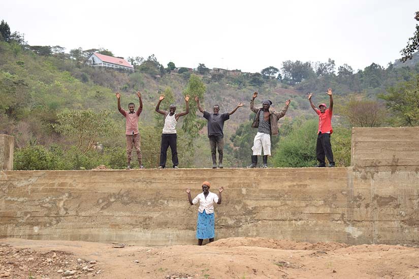 Photo: community members celebrating the completion of the sand dam at Kwa Kalekye.