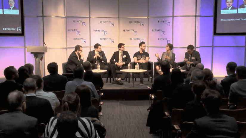 6 panelists sitting on a stage to discuss about the rise of digital finance and crypto assets